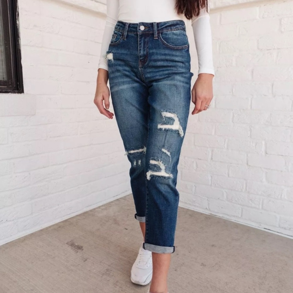 Judy Blue mid-rise boyfriend fit jeans with destroyed patches of beige.
